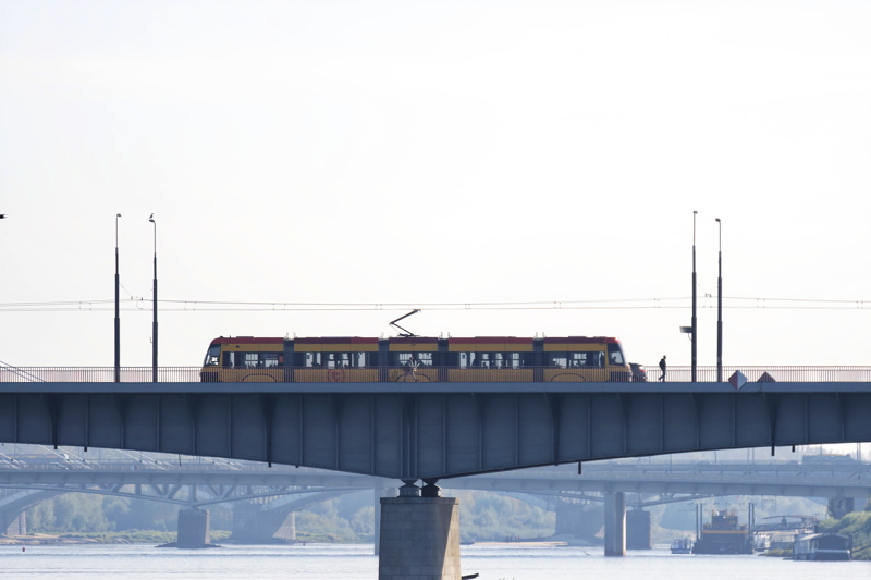 17 - A Pesa Swing tram crossing the Vistula River in Warsaw, Poland